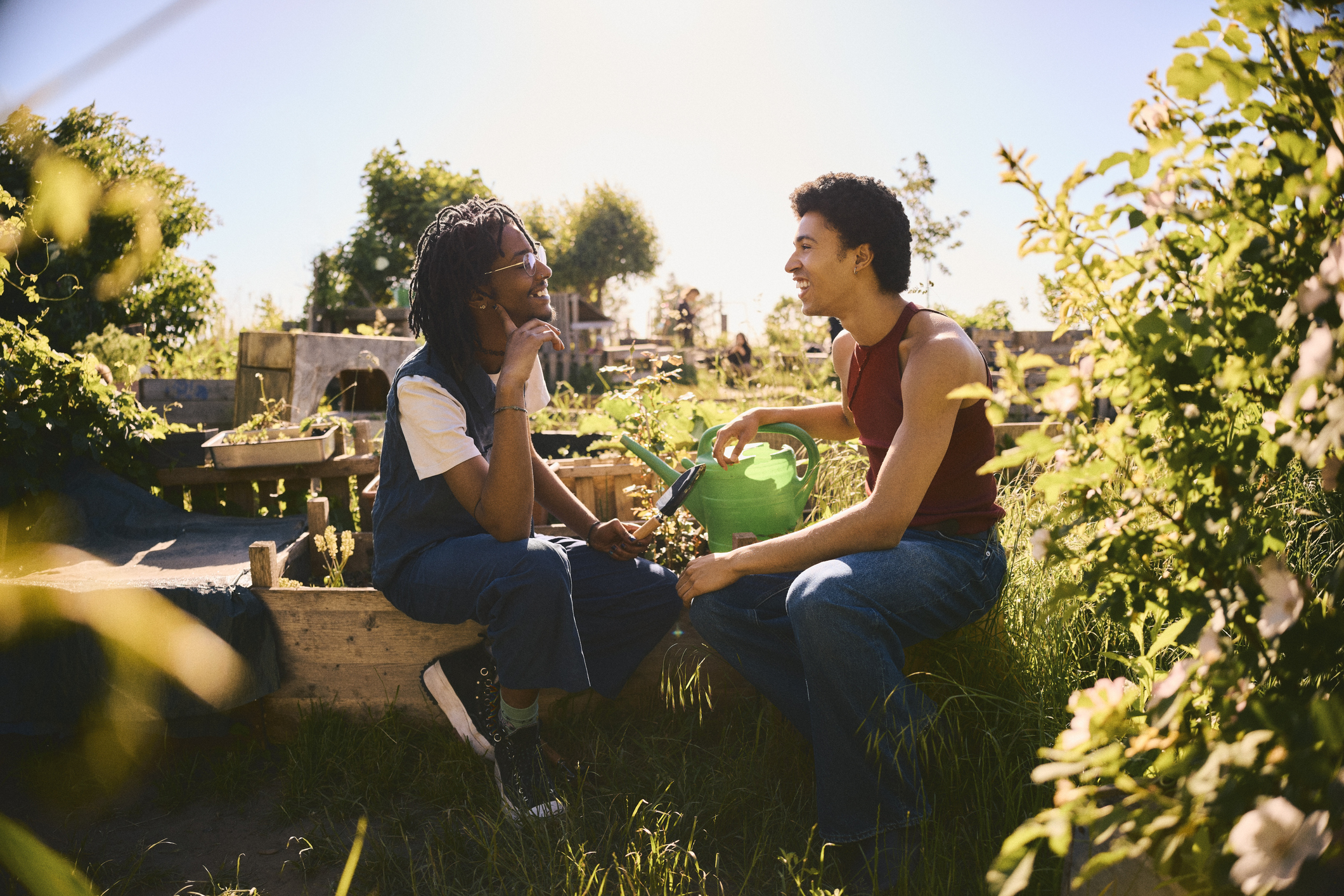 Two people chatting in an allotment together