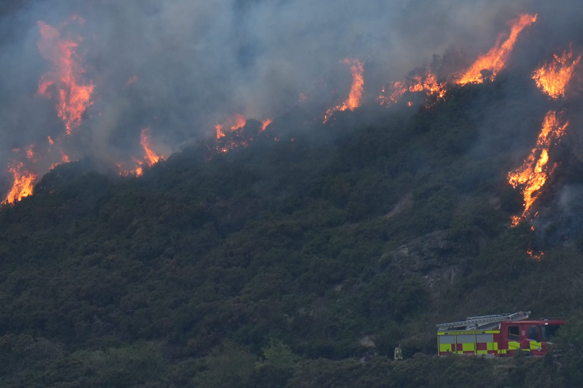 EDINBURGH, SCOTLAND - AUGUST 10: Scottish Fire and Rescue Service are at the scene of a wildfire on Arthur's Seat on August 10, 2025 in Edinburgh, Scotland. Scottish Fire and Rescue Service have reportedly been called out to a wildfire at Arthur's Seat, an iconic hill in Edinburgh's Holyrood Park, approximately one mile east of the city center. (Photo by Peter Summers/Getty Images)