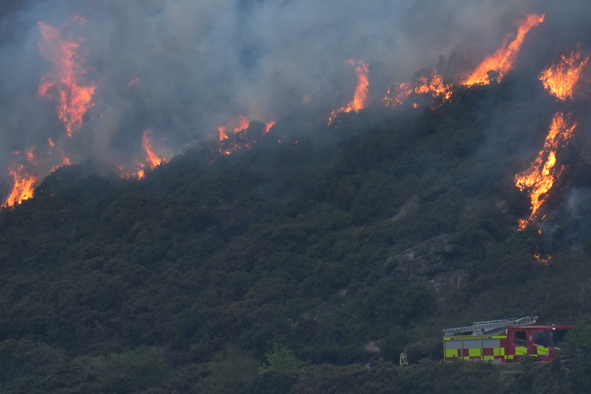 EDINBURGH, SCOTLAND - AUGUST 10: Scottish Fire and Rescue Service are at the scene of a wildfire on Arthur's Seat on August 10, 2025 in Edinburgh, Scotland. Scottish Fire and Rescue Service have reportedly been called out to a wildfire at Arthur's Seat, an iconic hill in Edinburgh's Holyrood Park, approximately one mile east of the city center. (Photo by Peter Summers/Getty Images)