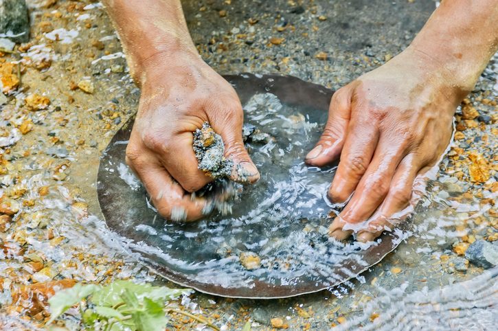 Gold Panner Closeup of hands gold panning in a river