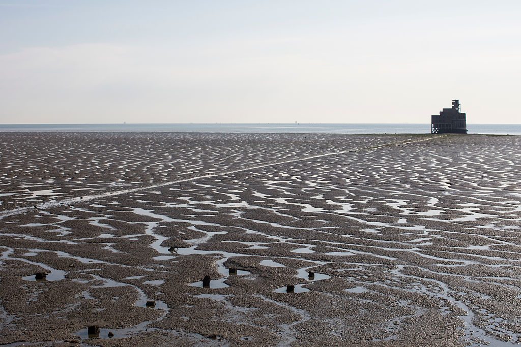 Grain Tower, a mid-19th-century gun tower is exposed by the receding tide on the Isle of Grain