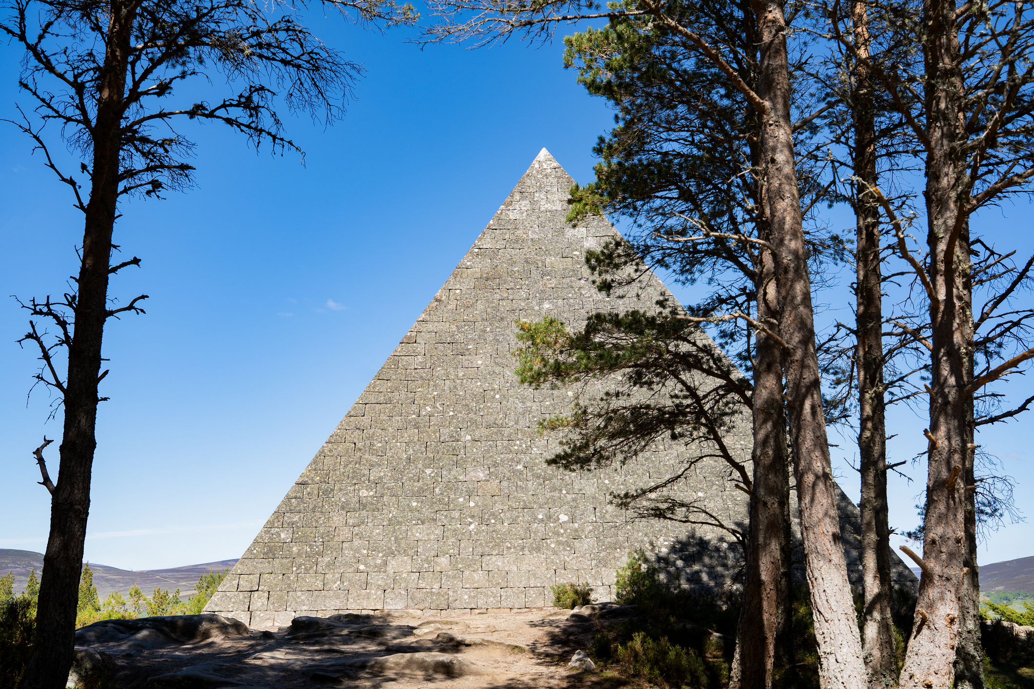 Prince Albert’s Cairn stone pyramid with trees in foreground