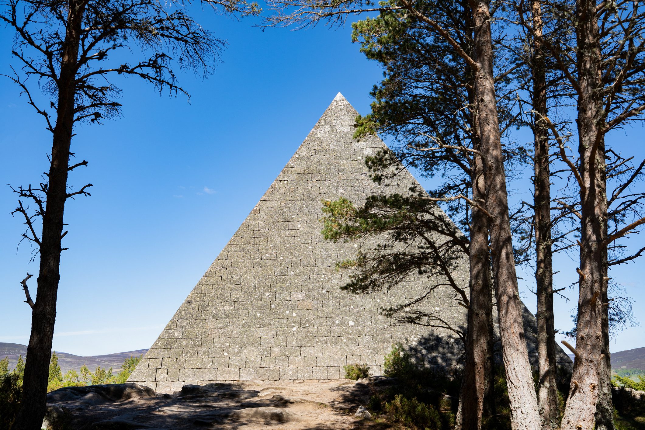 Prince Albert’s Cairn stone pyramid with trees in foreground