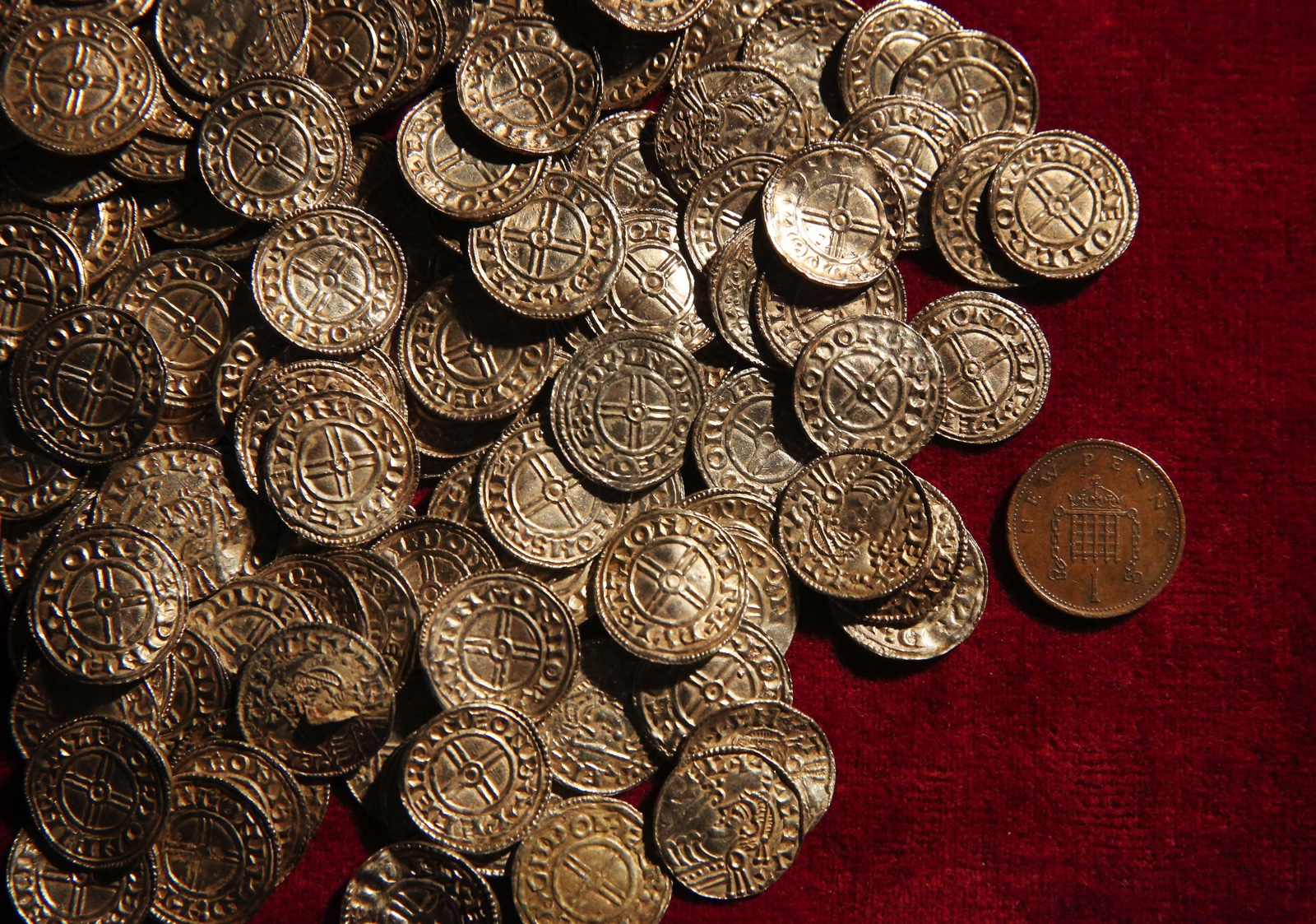 at British Museum on February 10, 2015 in London, England. The coins and other finds are being shown as the Treasure Annual Report 2012 is launched. Under the Treasure Act 1996 there is a legal obligation for finders to report what they find to the state. The silver Anglo Saxon coin hoard containing around 5,200 items was discovered in Lenborough, England in December 2014.