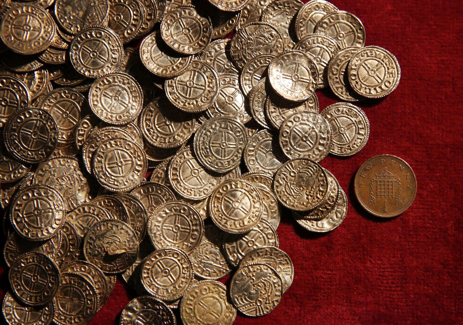 at British Museum on February 10, 2015 in London, England. The coins and other finds are being shown as the Treasure Annual Report 2012 is launched. Under the Treasure Act 1996 there is a legal obligation for finders to report what they find to the state. The silver Anglo Saxon coin hoard containing around 5,200 items was discovered in Lenborough, England in December 2014.
