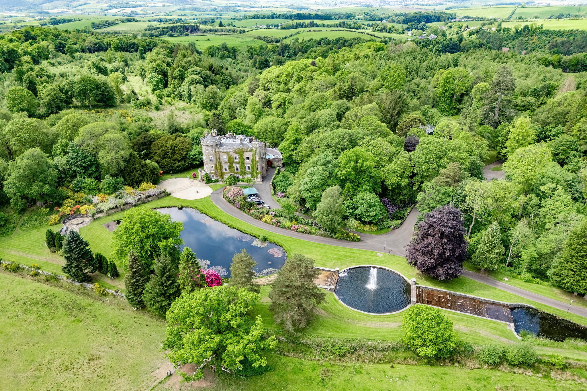 Cloincard castle seen from an aerial view including a pond