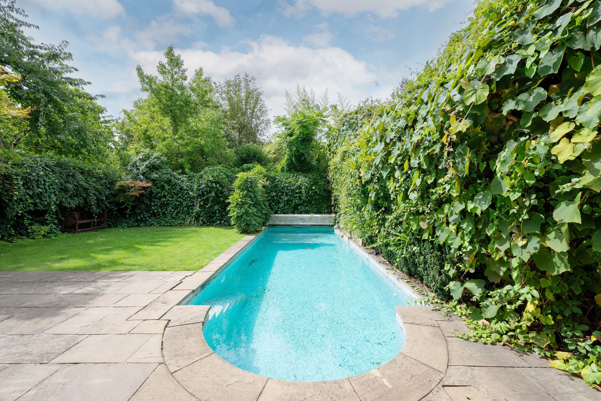 A swimming pool in the back-garden of a London property