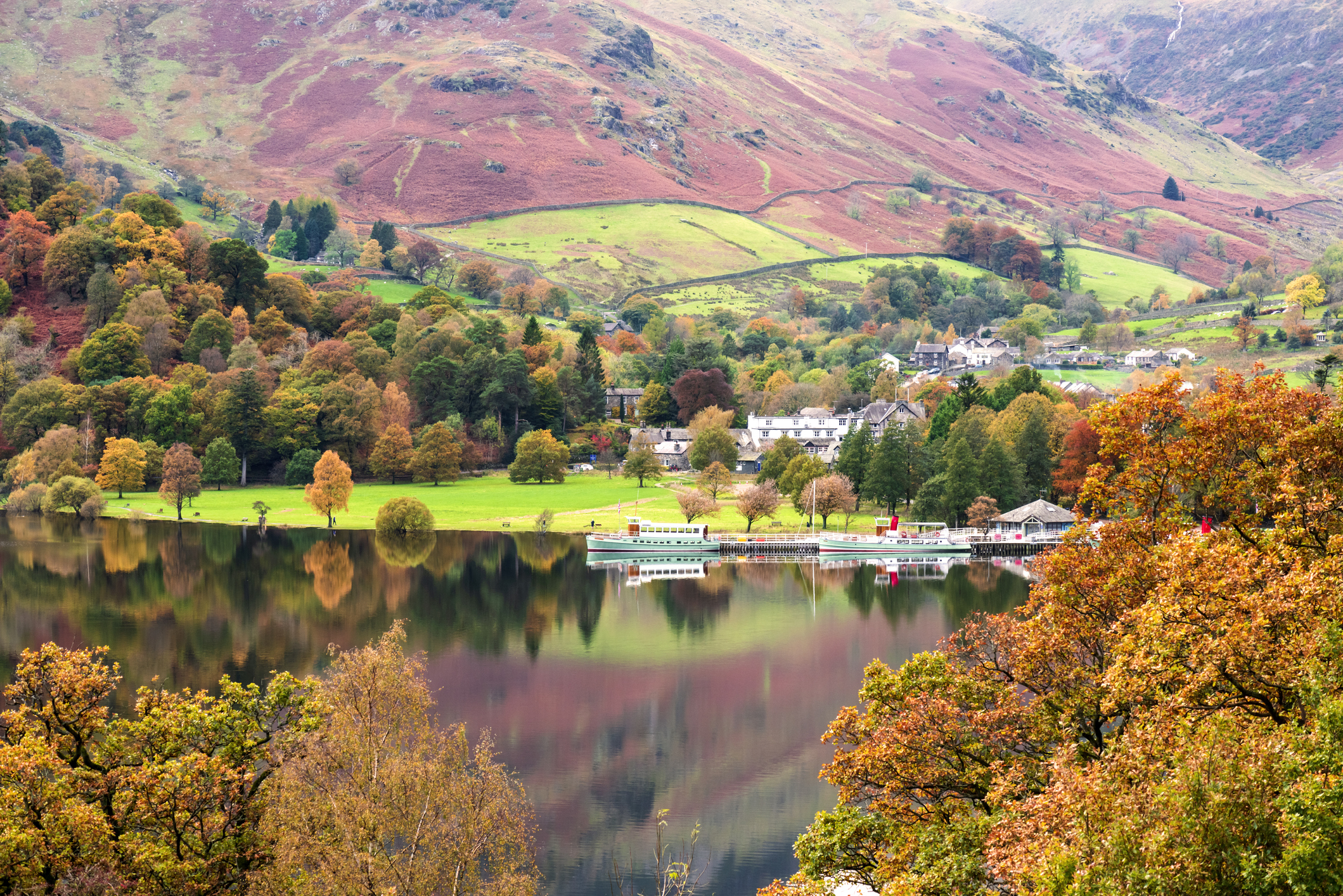 Steamer boats going along Ullswater in the Lake District