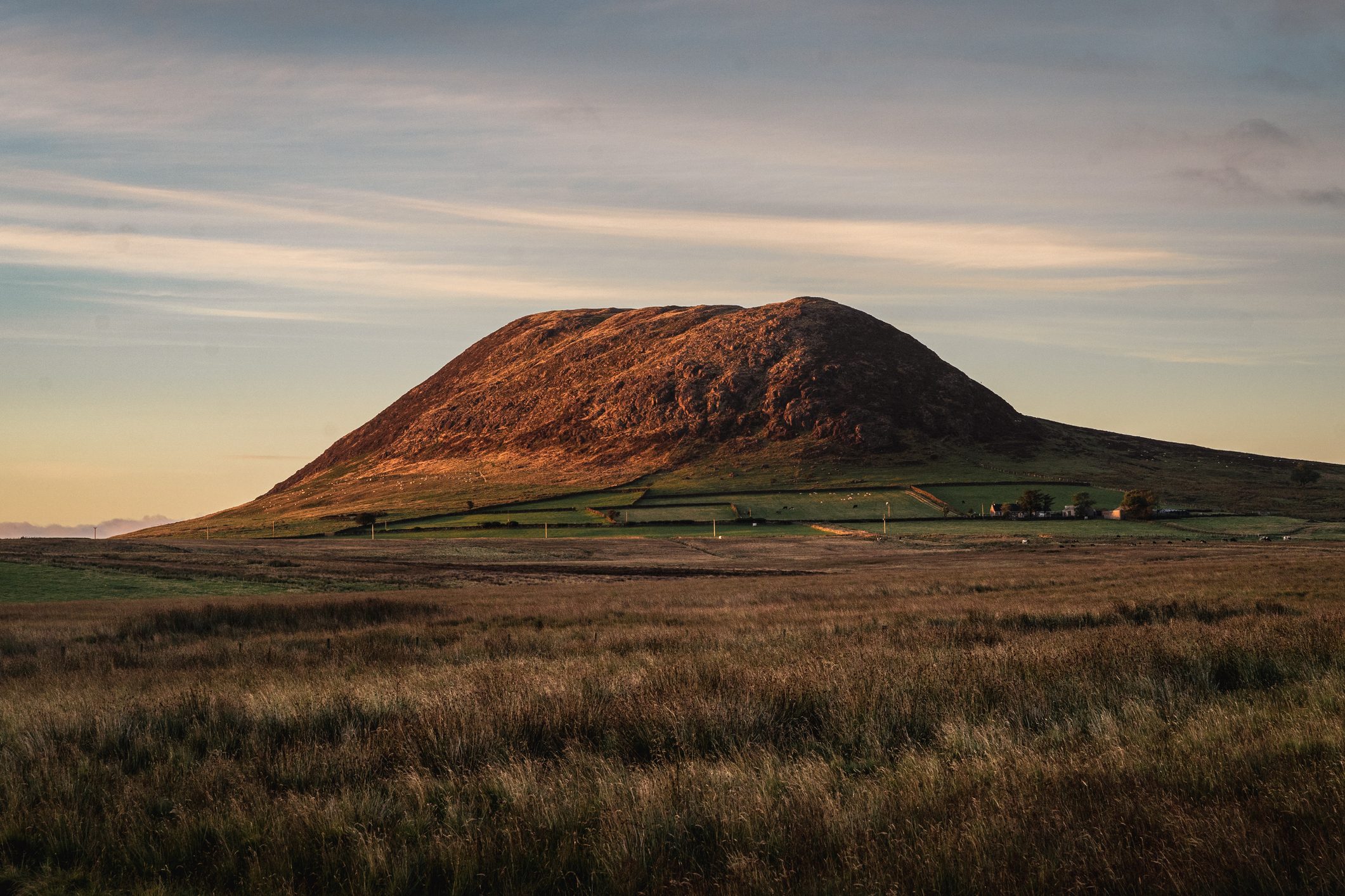 Slemish mountain seen during a summer evening as the sun sets