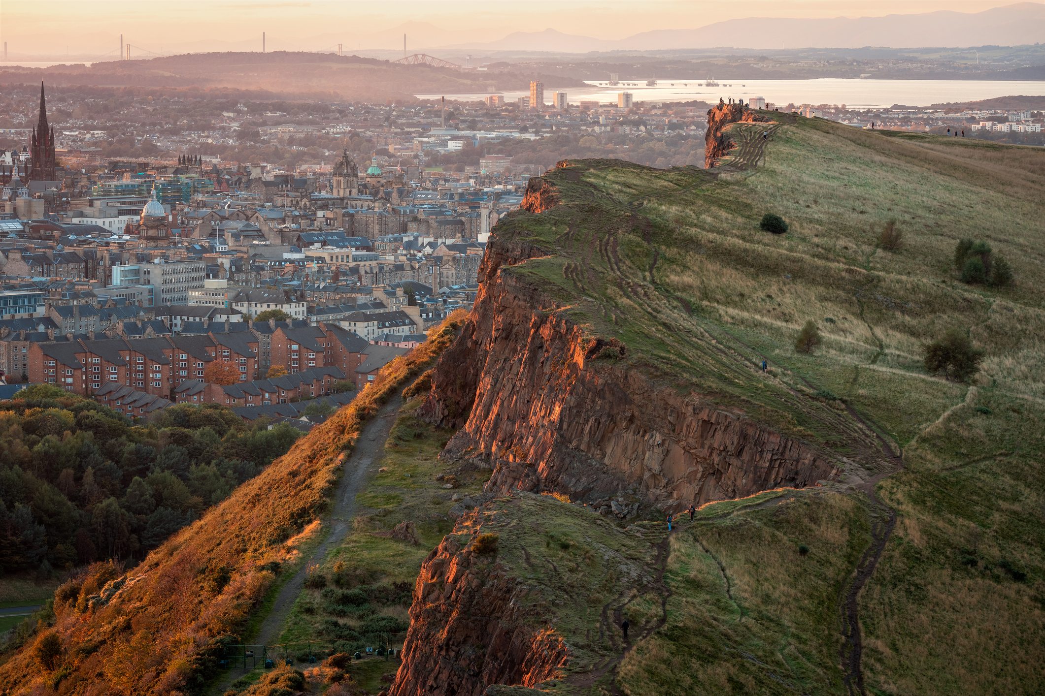 A photo of Arthur's Seat with a view of Edinburgh in the background