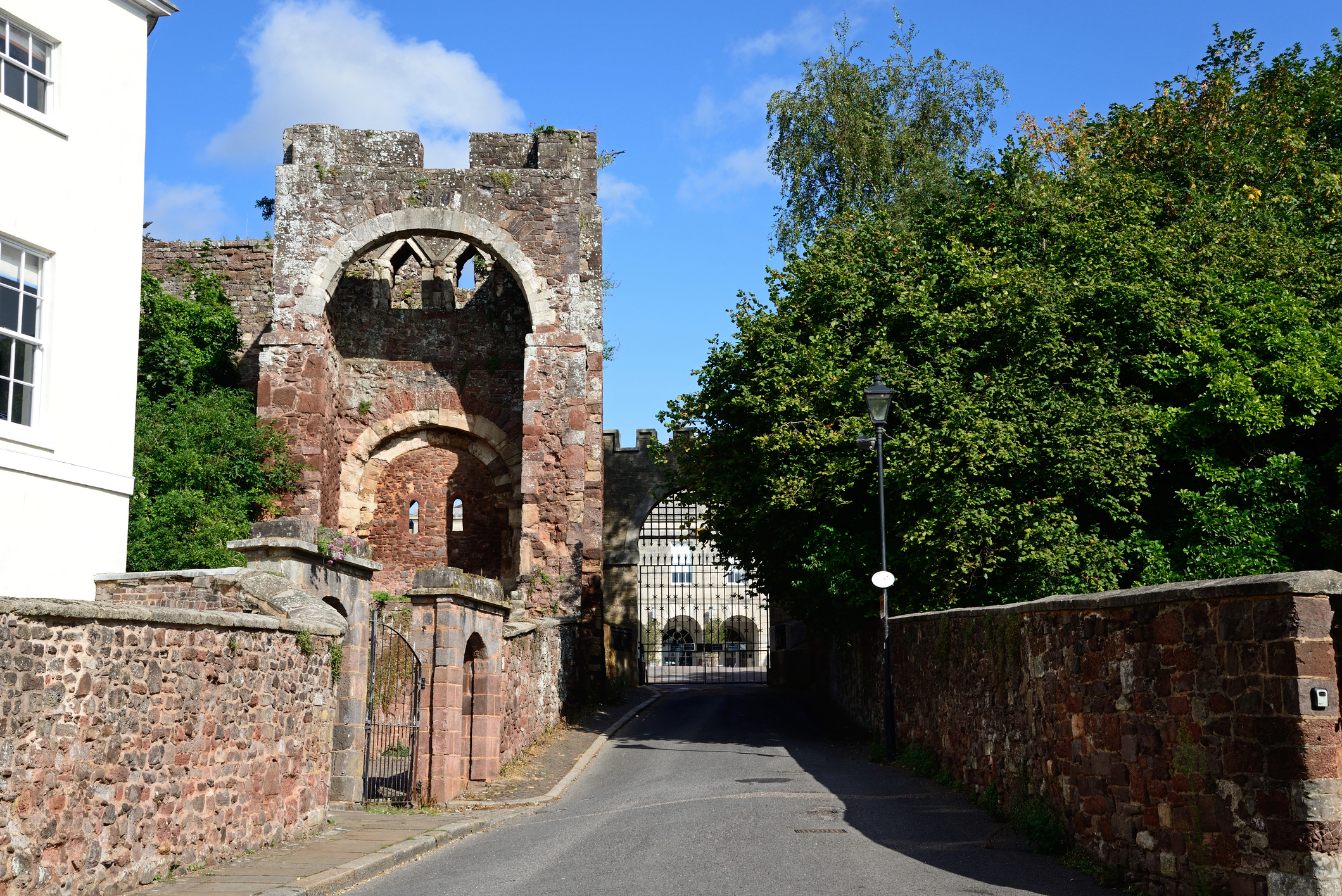 Remnants of Rougemont Castle in Exeter seen on the left hand side of a road.