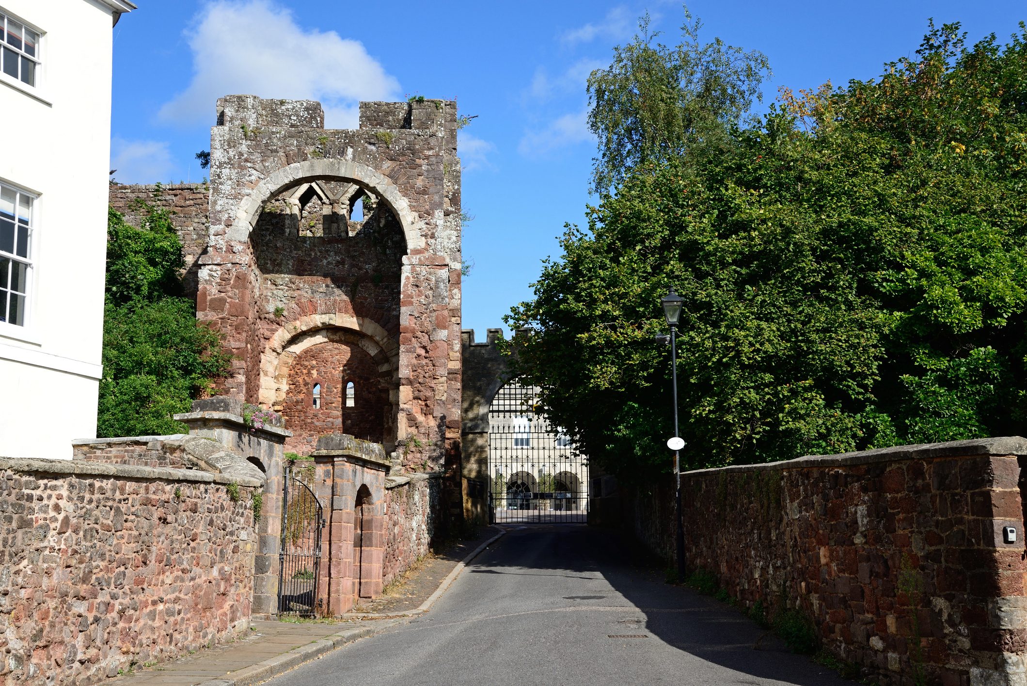 Remnants of Rougemont Castle in Exeter seen on the left hand side of a road.