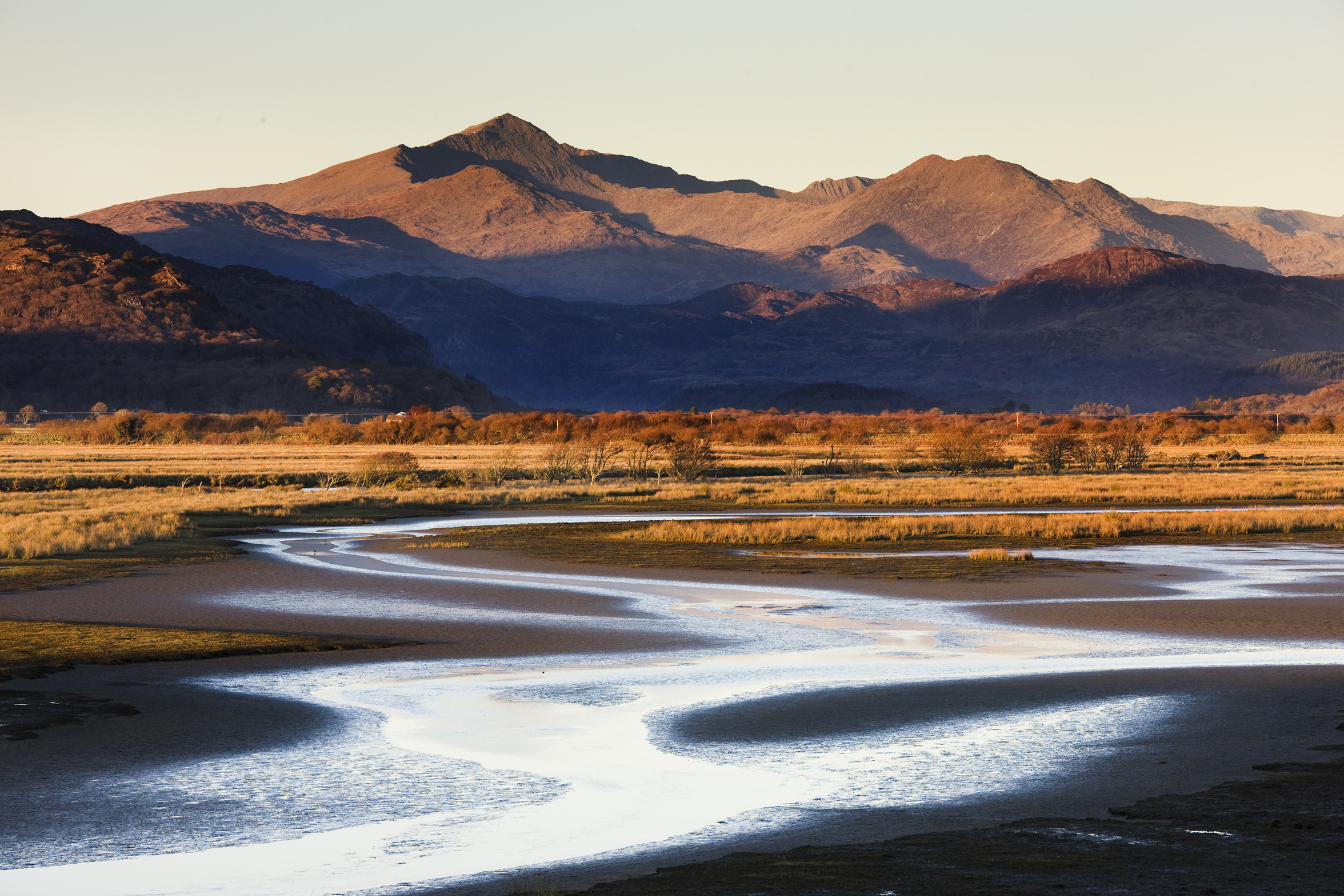 Snowdon seen during the setting evening sun from far away