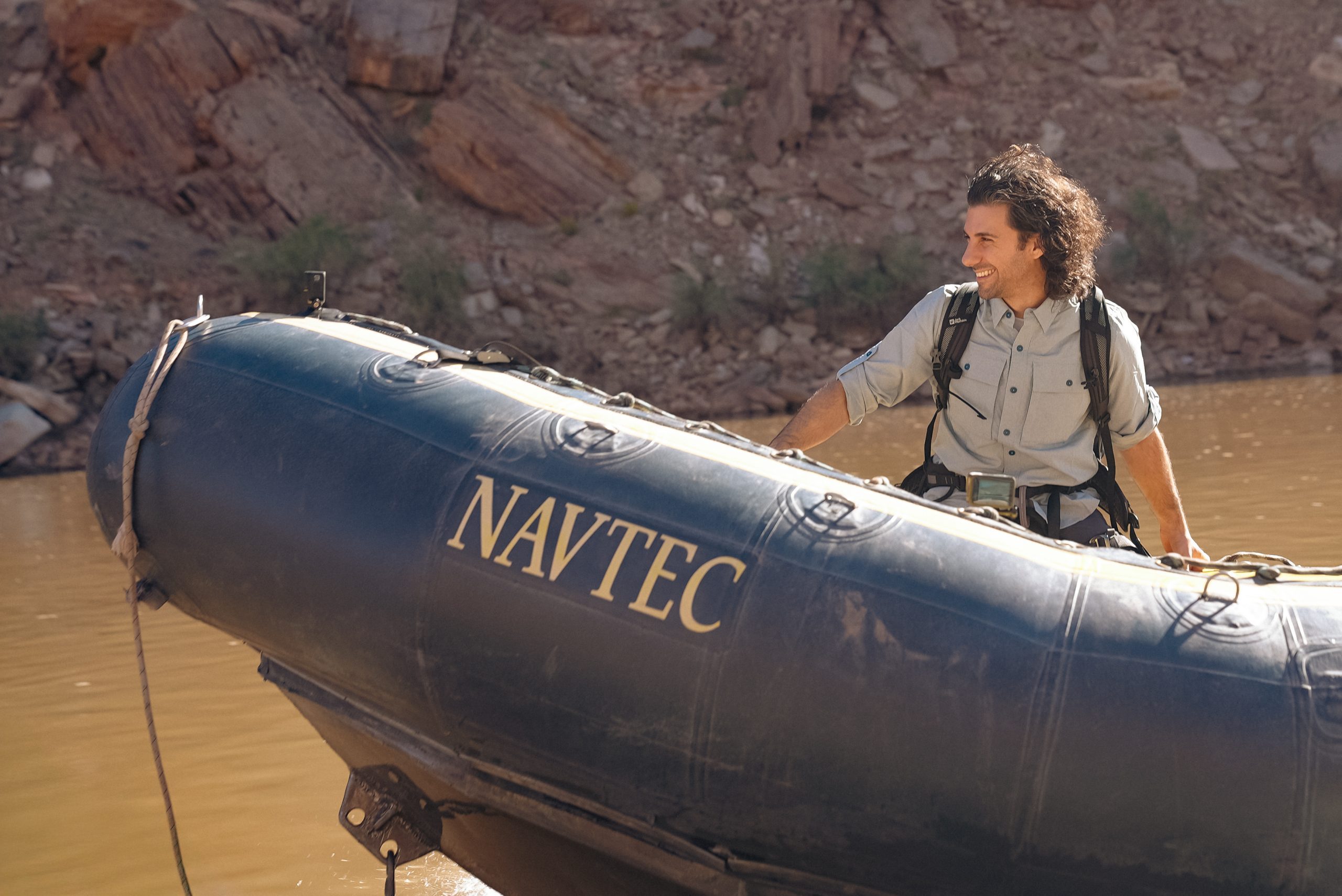 Noah James stood on a boat during filming of The Chosen in the Wild