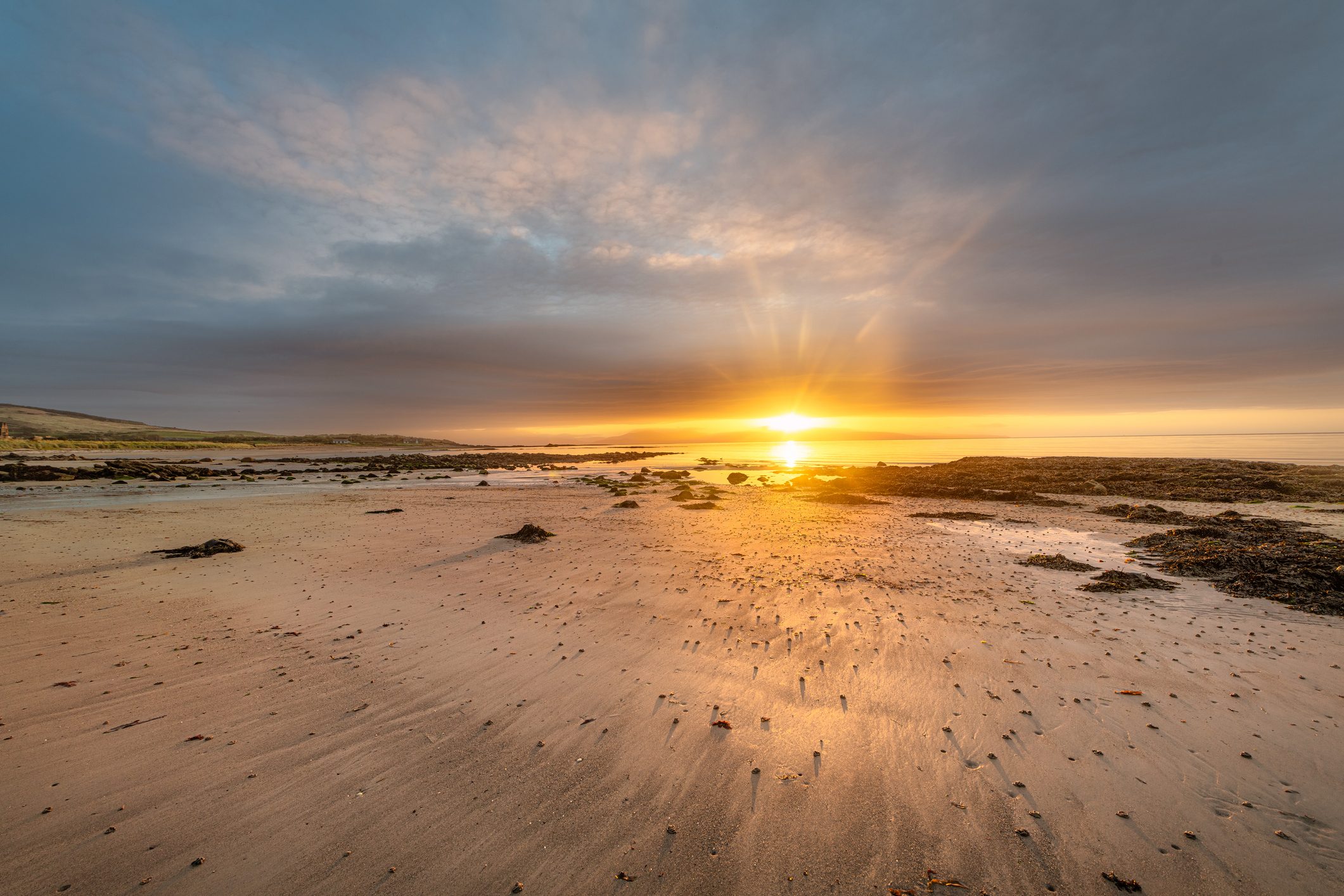 Breathtaking Sunrise over Beach at Mull of Kintyre